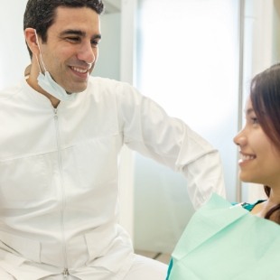 Woman smiling at her dentist in Nepean dental office