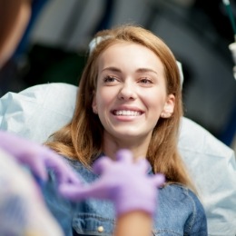 Young blonde woman smiling in dental chair