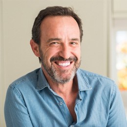 closeup of man smiling while indoors