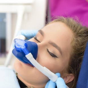 Young woman wearing mask for nitrous oxide sedation dentistry