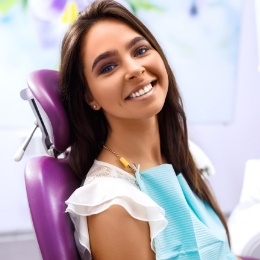 Young brunette woman smiling during dental visit