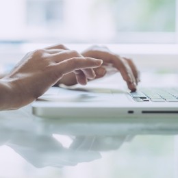 Person typing on a laptop