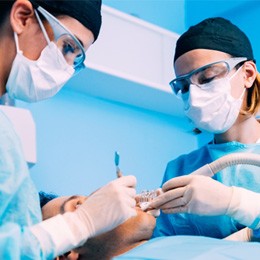 Dentists performing surgery