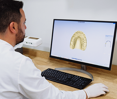Nepean dentist looking at digital impressions of teeth on computer