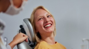 Woman smiling at her dentist before dental services in Nepean