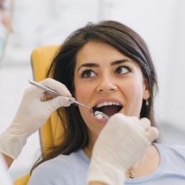 Dental patient opening her mouth during dental checkup