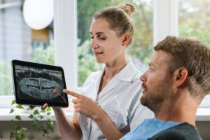 Dentist explaining X-ray to patient